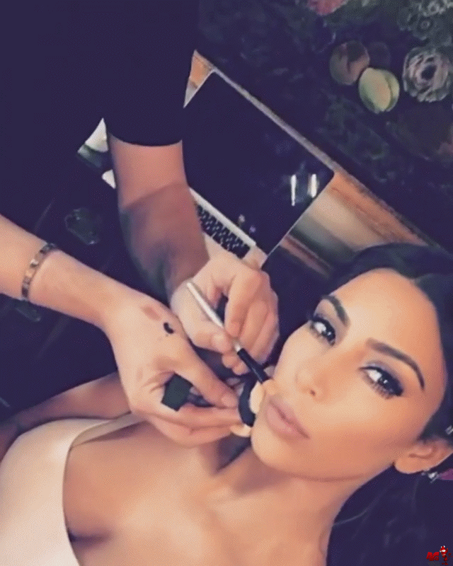 Kim Kardashian with makeup artist makes a video on the phone GIF - AngryGIF